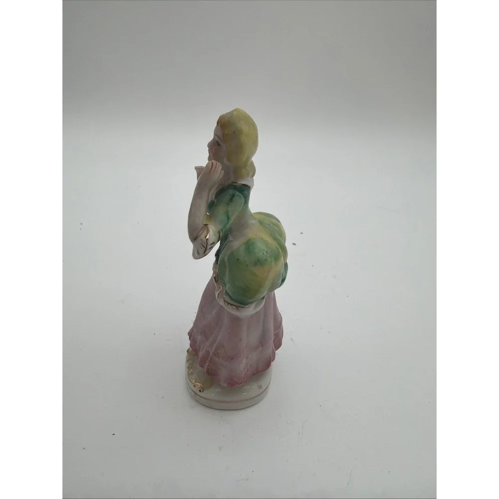 vintage hand-painted porcelain colonial or Victorian lady figurine